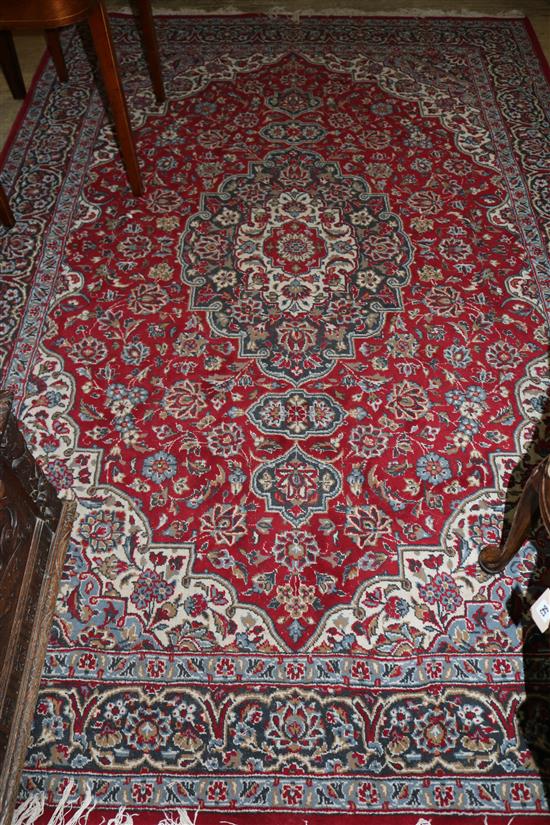 An Isphahan red ground medallion carpet(-)